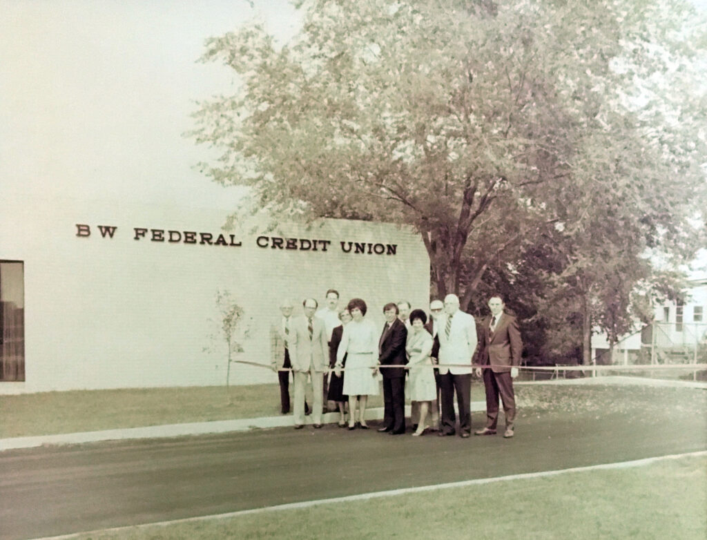 BW federal credit union building with employees standing in front